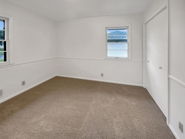 5808 Colfax Ave N, Brooklyn Center, MN 55430 - unfurnished bedroom with carpet flooring and a closet