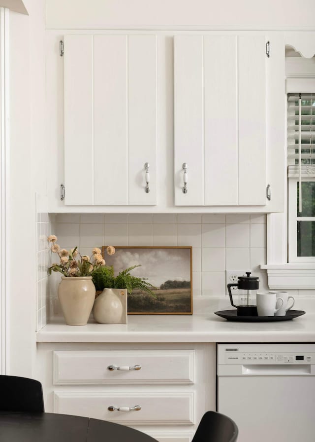 4604 39th St, Saint Louis Park, MN 55416 - kitchen featuring dishwasher, backsplash, white cabinetry, and light countertops