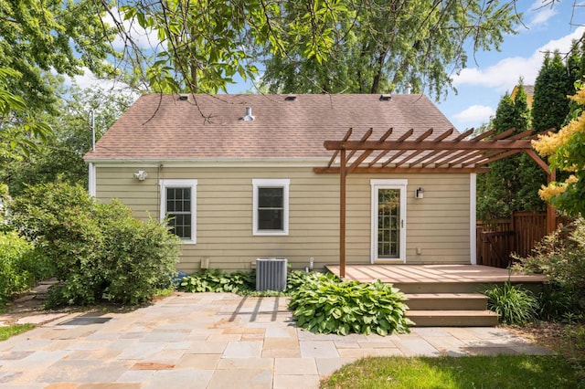 4604 39th St, Saint Louis Park, MN 55416 - rear view of house featuring a wooden deck, a pergola, roof with shingles, and a patio area