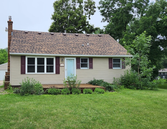 2633 23rd Ave SE, Rochester, MN 55904 - view of front of house with a shingled roof, a chimney, and a front yard