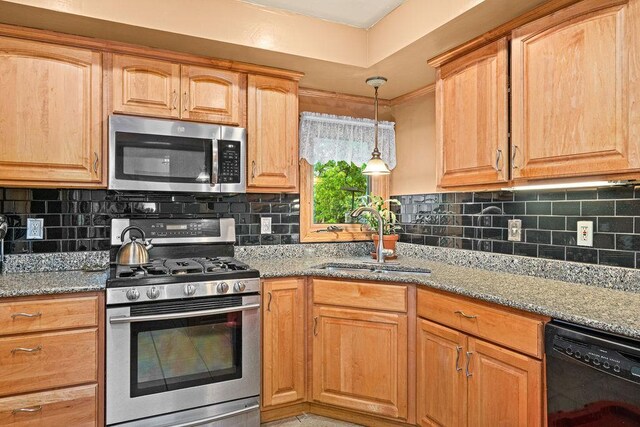 5120 Juniata St, Duluth, MN 55804 - kitchen with appliances with stainless steel finishes, light stone counters, tasteful backsplash, and pendant lighting