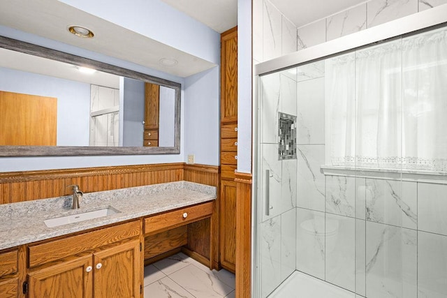 5120 Juniata St, Duluth, MN 55804 - full bath with marble look tile flooring, a marble finish shower, vanity, a wainscoted wall, and recessed lighting