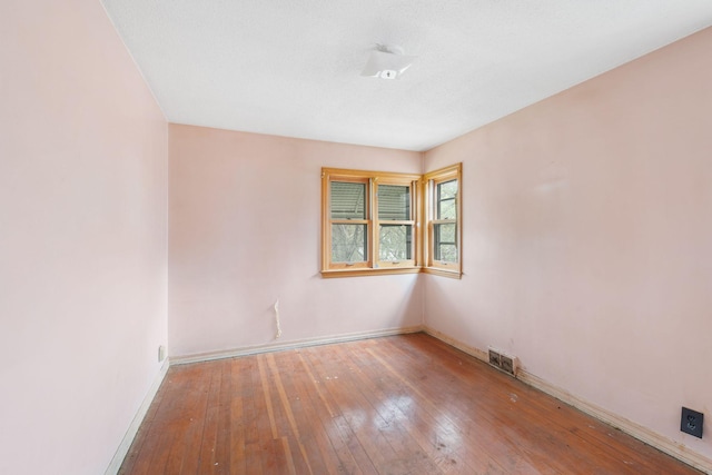5123 Chicago Ave, Minneapolis, MN 55417 - spare room featuring baseboards and hardwood / wood-style flooring