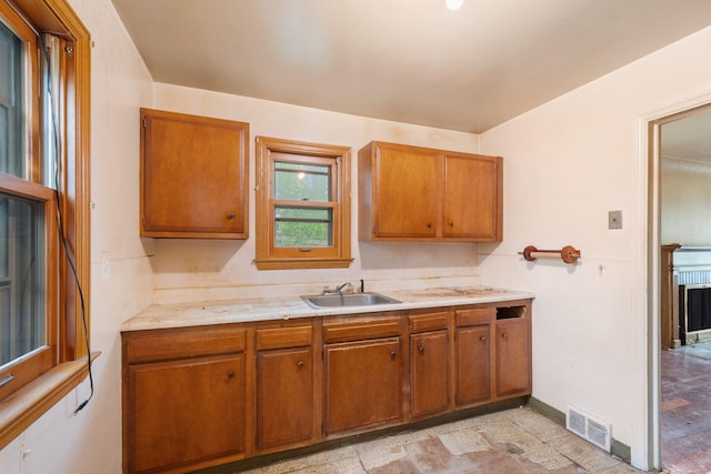 5123 Chicago Ave, Minneapolis, MN 55417 - kitchen featuring brown cabinets and light countertops