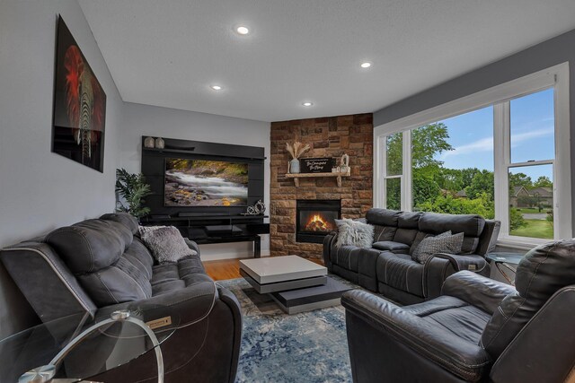 1302 Grizzly Ln, Sartell, MN 56377 - living room featuring recessed lighting, wood finished floors, and a fireplace