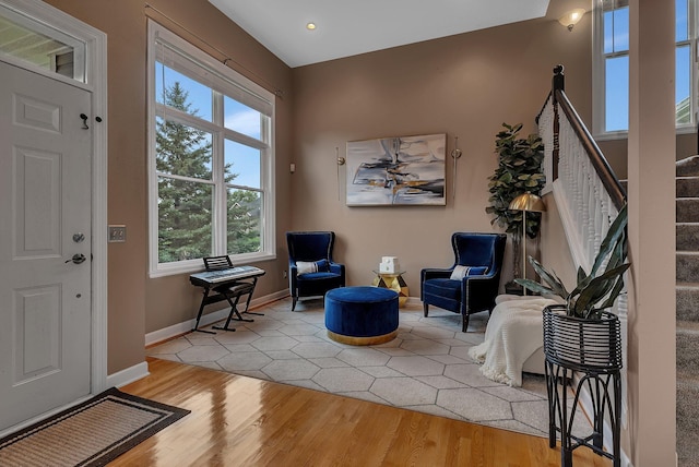 1302 Grizzly Ln, Sartell, MN 56377 - foyer with light wood-style flooring, healthy amount of natural light, and stairs