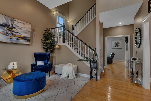 1302 Grizzly Ln, Sartell, MN 56377 - foyer entrance featuring wood finished floors, stairway, and recessed lighting
