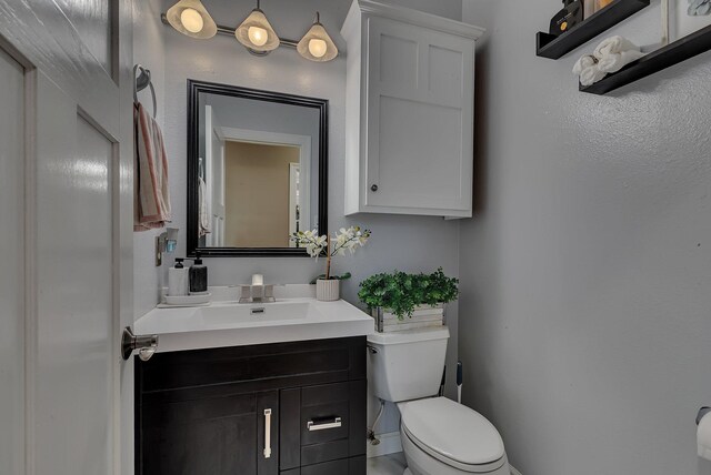 1302 Grizzly Ln, Sartell, MN 56377 - bathroom with vanity and toilet