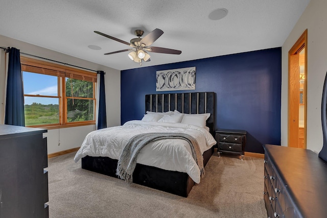 1302 Grizzly Ln, Sartell, MN 56377 - bedroom featuring carpet floors, a textured ceiling, and ceiling fan