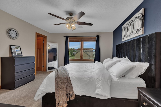 1302 Grizzly Ln, Sartell, MN 56377 - bedroom featuring carpet floors, a textured ceiling, and ceiling fan