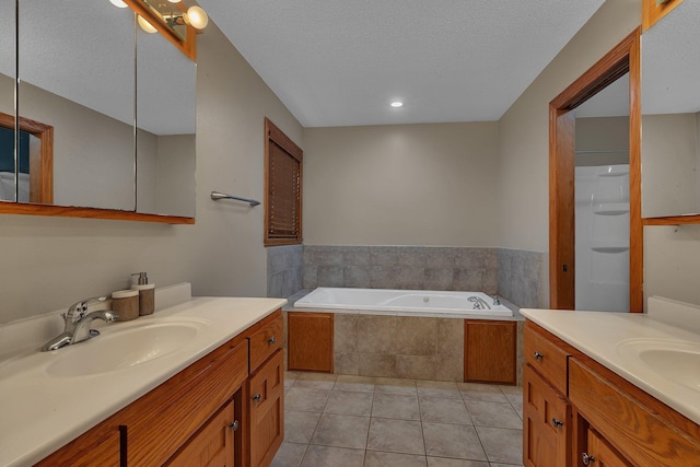 1302 Grizzly Ln, Sartell, MN 56377 - bathroom featuring two vanities, a bath, tile patterned flooring, and a textured ceiling