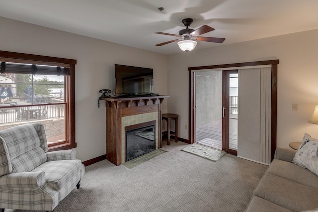 502 Cleveland Blvd Unit 3200, Walker, MN 56484 - living area featuring a ceiling fan, a tiled fireplace, and light colored carpet