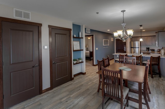 502 Cleveland Blvd Unit 3200, Walker, MN 56484 - dining space with a chandelier, light wood-style floors, and recessed lighting