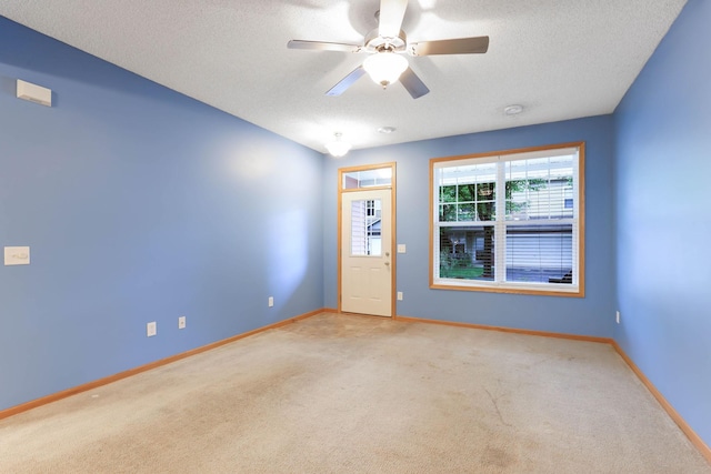 15652 Emerald Dr N Unit 3, Hugo, MN 55038 - carpeted empty room with a textured ceiling, ceiling fan, and a smoke detector