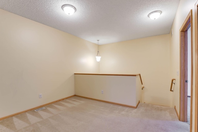 15652 Emerald Dr N Unit 3, Hugo, MN 55038 - carpeted spare room with a textured ceiling and baseboards