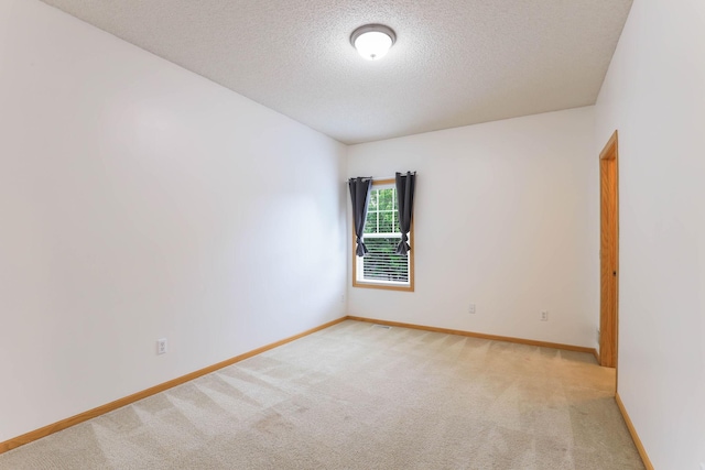 15652 Emerald Dr N Unit 3, Hugo, MN 55038 - spare room with a textured ceiling and light colored carpet