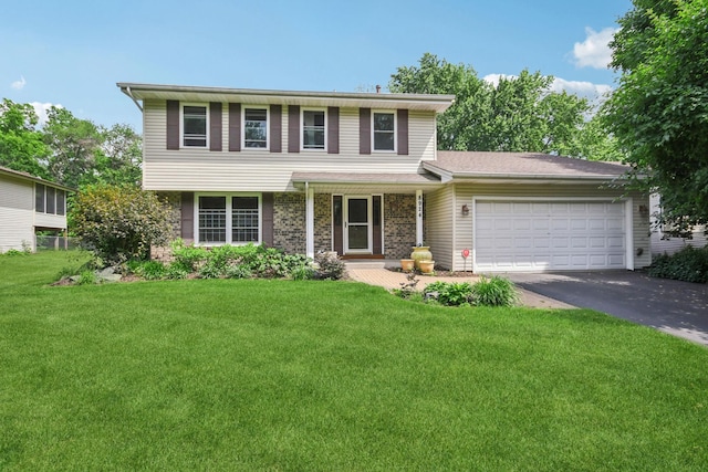 8924 Darnel Rd, Eden Prairie, MN 55347 - view of front of home with an attached garage, a front lawn, and driveway