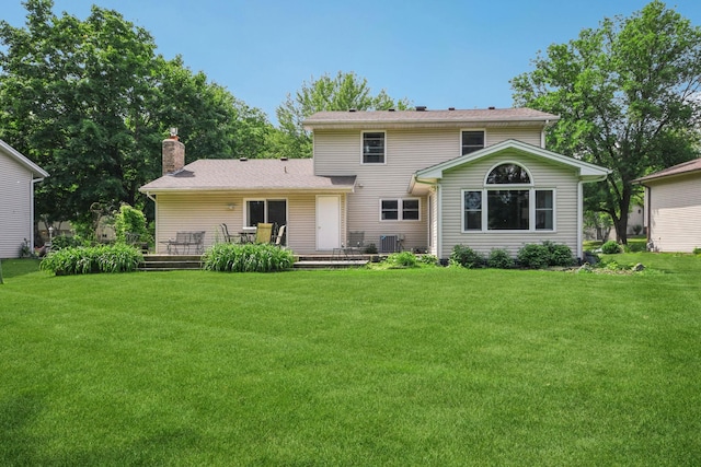8924 Darnel Rd, Eden Prairie, MN 55347 - back of house with a yard and a chimney