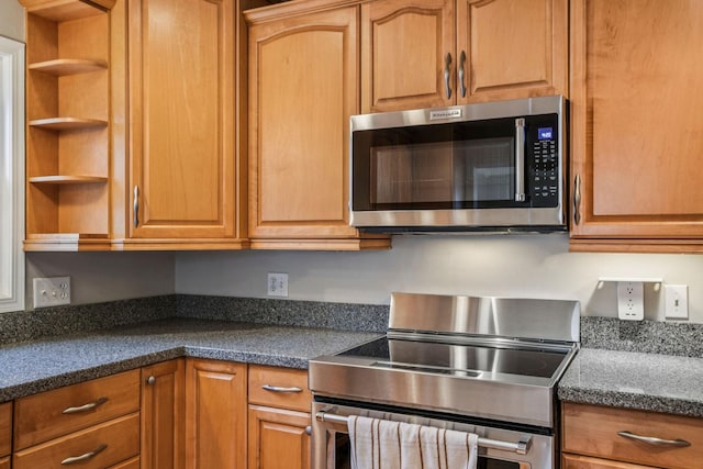 8924 Darnel Rd, Eden Prairie, MN 55347 - kitchen with stainless steel appliances, open shelves, and brown cabinets