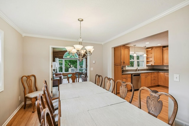 8924 Darnel Rd, Eden Prairie, MN 55347 - dining space with light wood-type flooring, crown molding, plenty of natural light, and a chandelier
