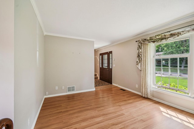 8924 Darnel Rd, Eden Prairie, MN 55347 - spare room with ornamental molding, healthy amount of natural light, and light wood finished floors