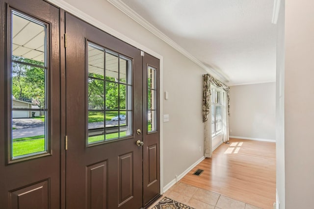 8924 Darnel Rd, Eden Prairie, MN 55347 - foyer featuring ornamental molding and light tile patterned floors