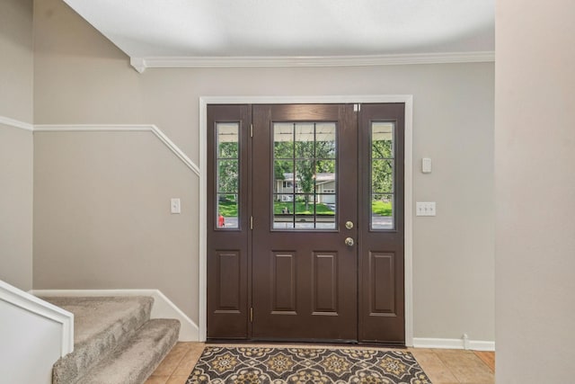 8924 Darnel Rd, Eden Prairie, MN 55347 - entrance foyer with tile patterned floors, stairs, and ornamental molding