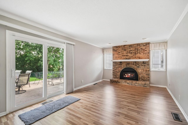 8924 Darnel Rd, Eden Prairie, MN 55347 - unfurnished living room featuring ornamental molding, wood finished floors, and a fireplace