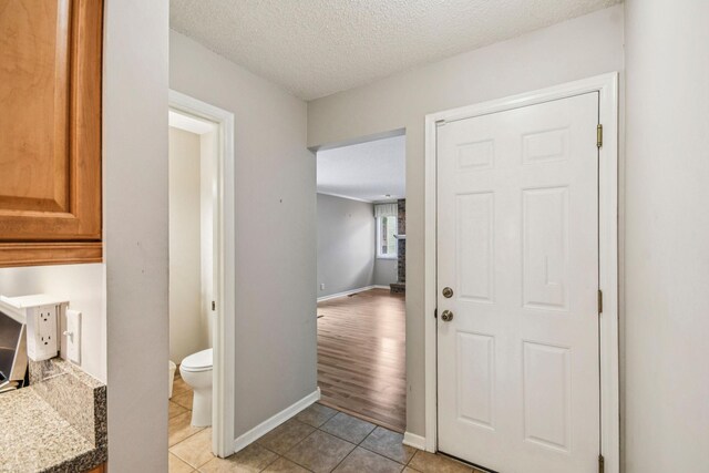 8924 Darnel Rd, Eden Prairie, MN 55347 - hall featuring light tile patterned flooring and a textured ceiling