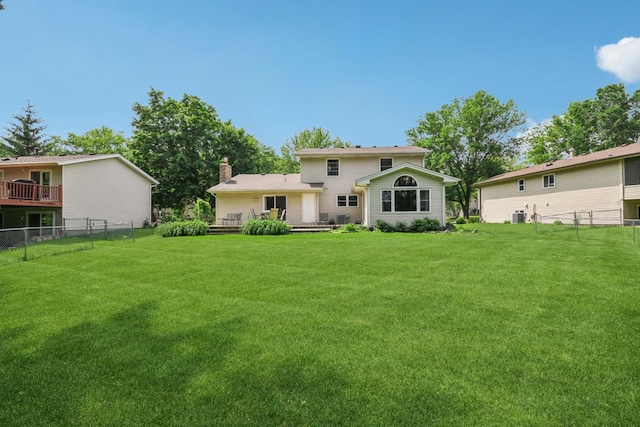 8924 Darnel Rd, Eden Prairie, MN 55347 - rear view of house with a chimney and a deck