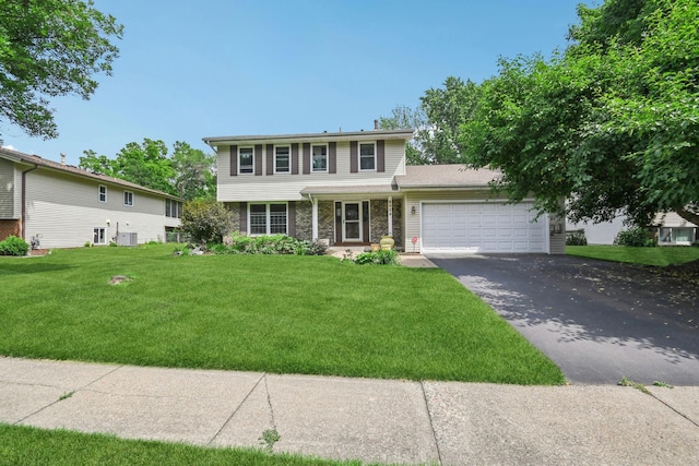 8924 Darnel Rd, Eden Prairie, MN 55347 - view of front facade featuring a garage, driveway, and a front yard