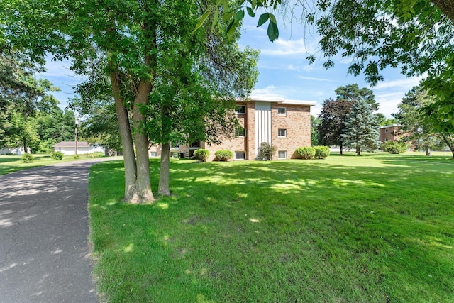1150 Dellwood St S Unit 306, Cambridge, MN 55008 - view of front of property with a front yard and brick siding