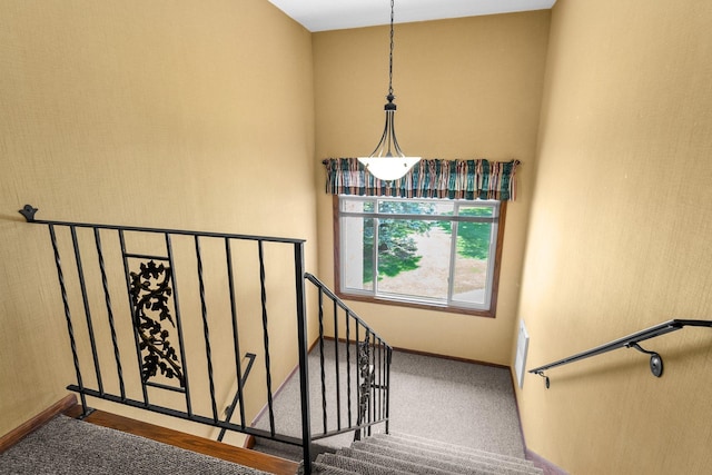 1150 Dellwood St S Unit 306, Cambridge, MN 55008 - staircase with baseboards and a towering ceiling