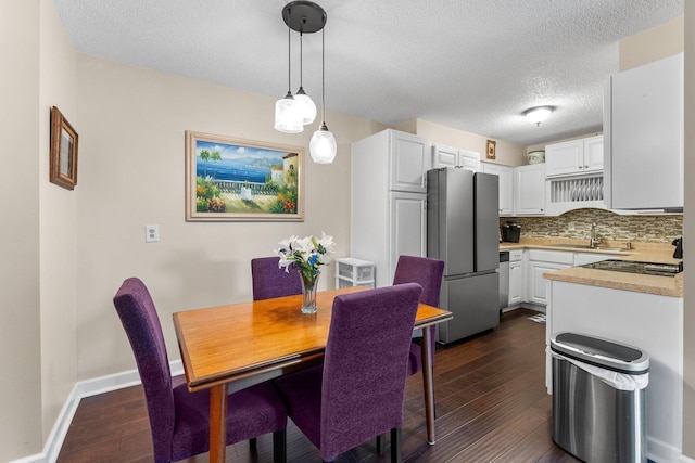 1150 Dellwood St S Unit 306, Cambridge, MN 55008 - dining space with dark wood-type flooring and a textured ceiling