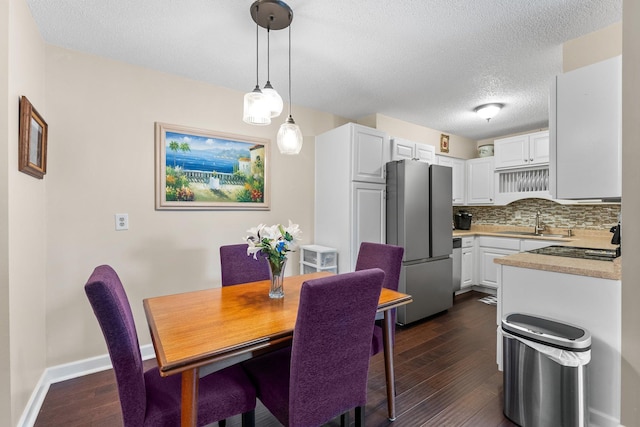 1150 Dellwood St S Unit 306, Cambridge, MN 55008 - dining area with dark wood finished floors and a textured ceiling