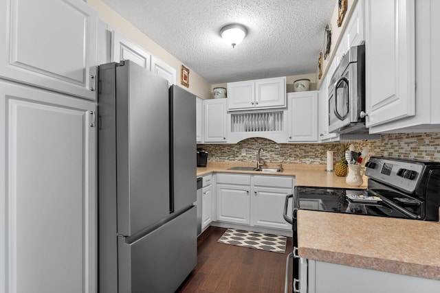 1150 Dellwood St S Unit 306, Cambridge, MN 55008 - kitchen with appliances with stainless steel finishes, dark wood-style floors, white cabinetry, and a textured ceiling