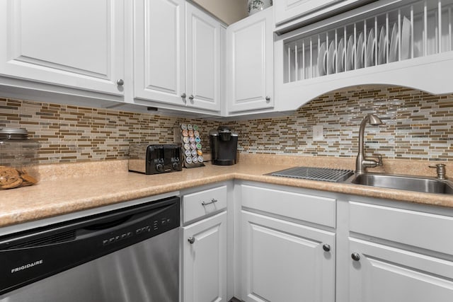 1150 Dellwood St S Unit 306, Cambridge, MN 55008 - kitchen with stainless steel dishwasher, white cabinets, light countertops, and backsplash