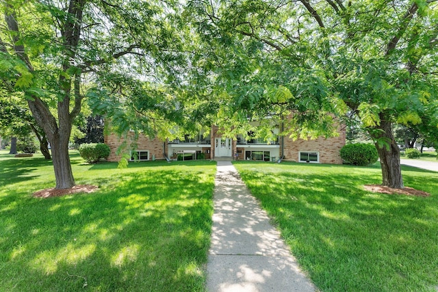 1150 Dellwood St S Unit 306, Cambridge, MN 55008 - tri-level home featuring brick siding and a front lawn
