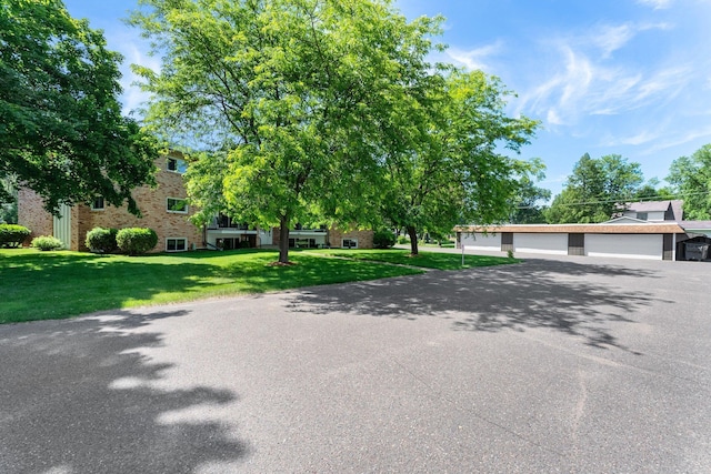 1150 Dellwood St S Unit 306, Cambridge, MN 55008 - view of front of house with a front yard and brick siding