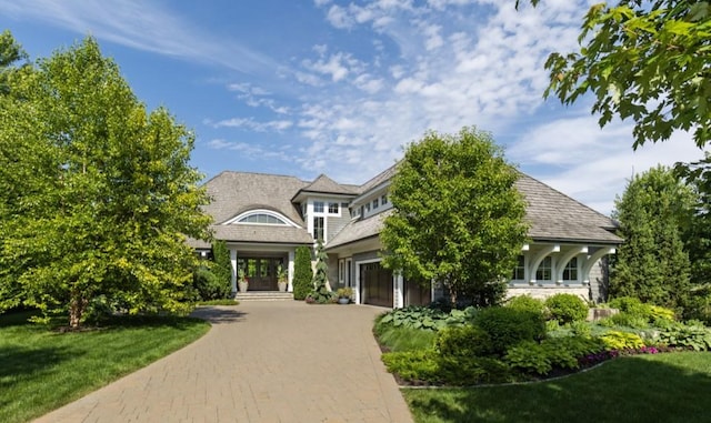 1595 Locust Hills Cir, Wayzata, MN 55391 - shingle-style home featuring decorative driveway