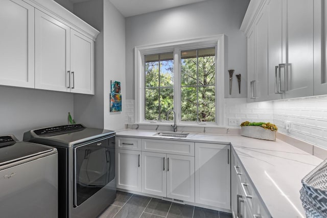 1595 Locust Hills Cir, Wayzata, MN 55391 - laundry room with cabinet space and independent washer and dryer