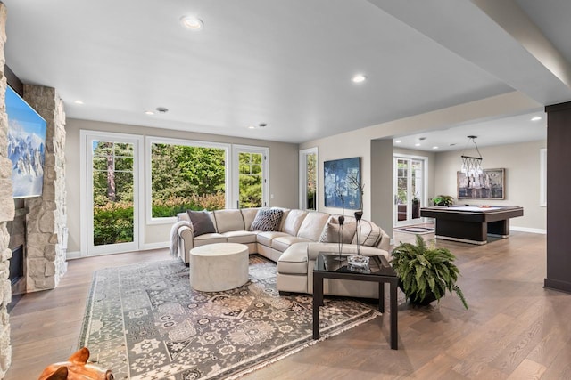 1595 Locust Hills Cir, Wayzata, MN 55391 - living area featuring billiards, plenty of natural light, recessed lighting, wood finished floors, and a stone fireplace