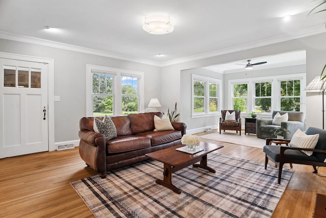 1511 Branston St, Saint Paul, MN 55108 - living room featuring light wood finished floors, ornamental molding, and a ceiling fan