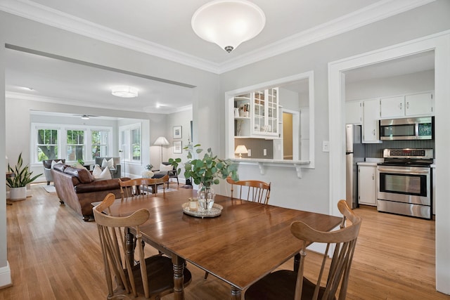 1511 Branston St, Saint Paul, MN 55108 - dining space featuring light wood finished floors, crown molding, and ceiling fan