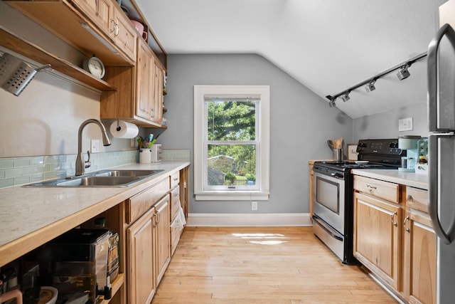 1511 Branston St, Saint Paul, MN 55108 - kitchen with stainless steel range oven, lofted ceiling, open shelves, light wood-style flooring, and light countertops