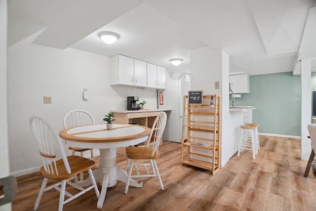 1511 Branston St, Saint Paul, MN 55108 - dining room with light wood-style flooring and baseboards