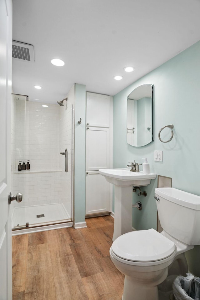 1511 Branston St, Saint Paul, MN 55108 - bathroom with wood finished floors, a stall shower, and recessed lighting