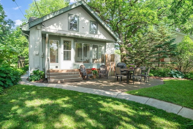 1511 Branston St, Saint Paul, MN 55108 - rear view of house featuring stucco siding and a patio