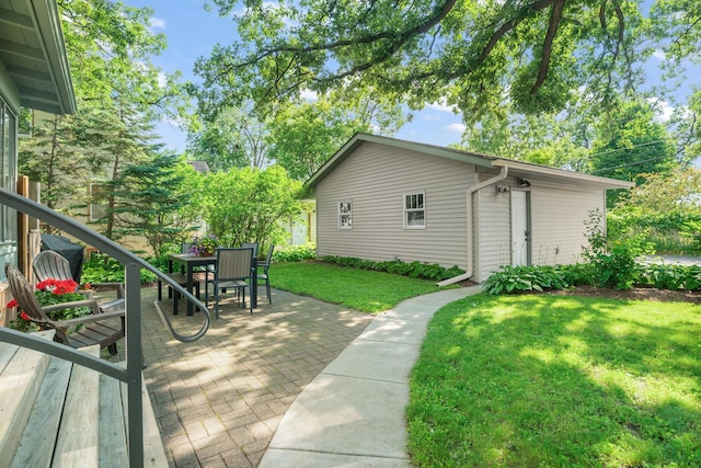 1511 Branston St, Saint Paul, MN 55108 - wooden deck featuring a lawn, a patio area, and outdoor dining area