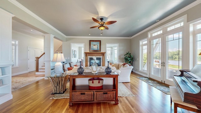 830 Prairie Island Rd N, Winona, MN 55987 - living room with wood finished floors, french doors, ceiling fan, and crown molding